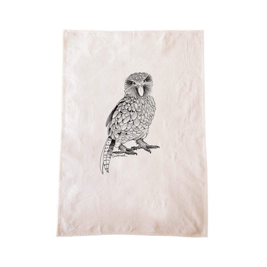 Off-white cotton tea towel with a screen printed Kākāpō design.