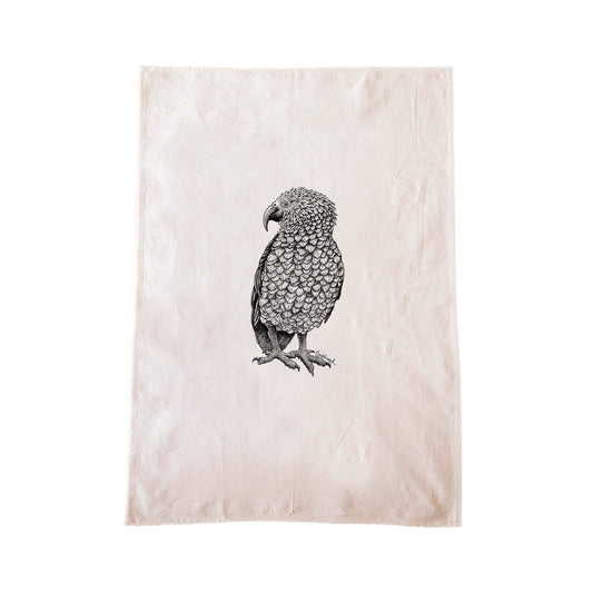 Off-white cotton tea towel with a screen printed Kea design.